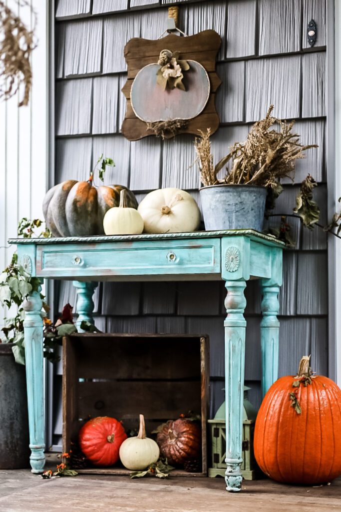 blue table with pumpkins