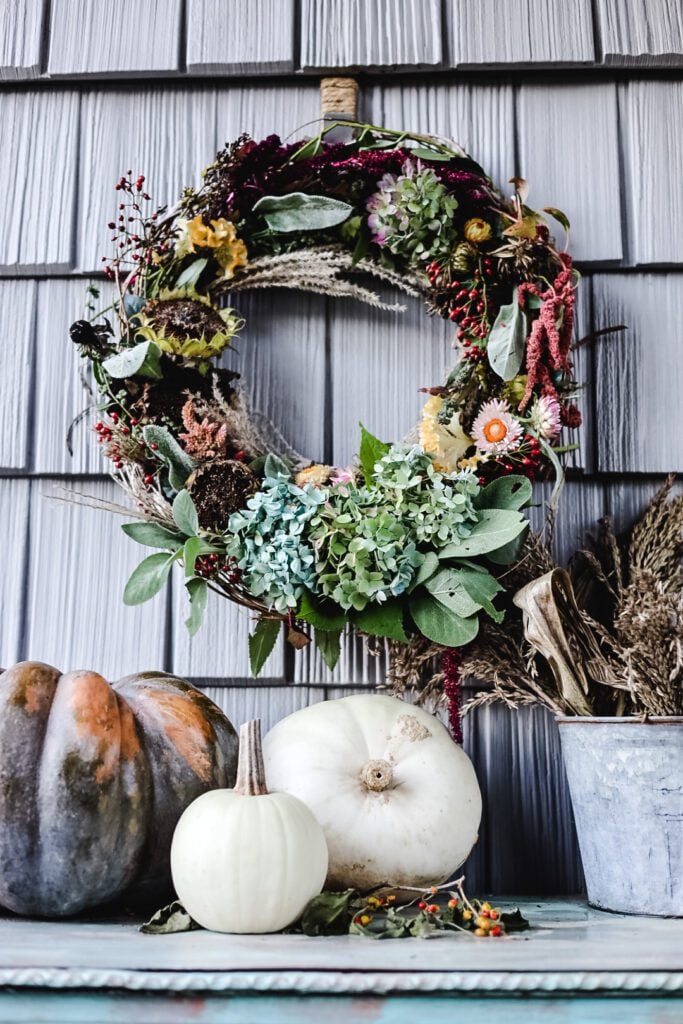 A Fall Dried flower wreath with pumpkins