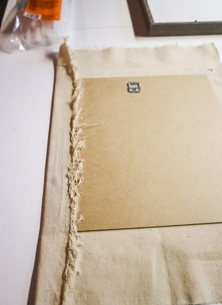 hot gluing fabric to a shadow box frame