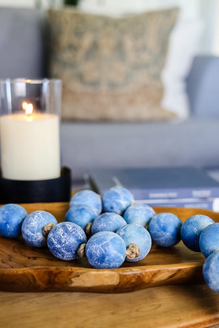 blue garland on wood tray