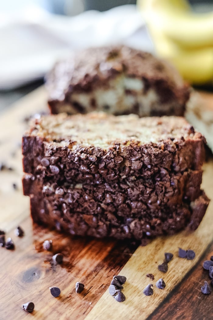 sliced chocolate chip banana bread on cutting board