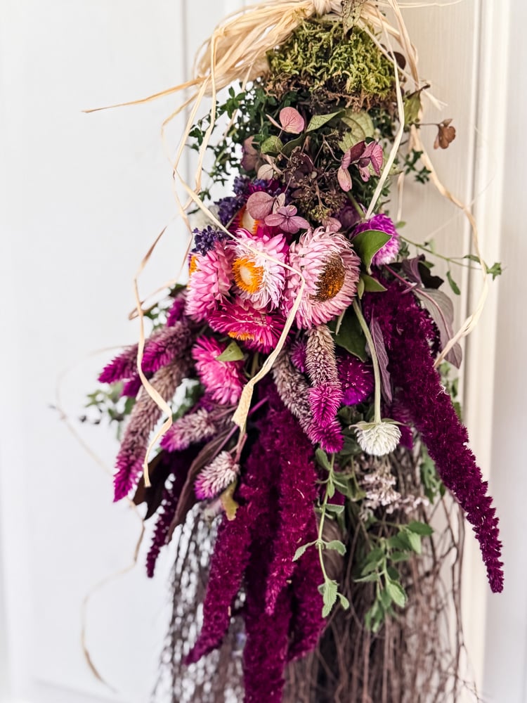 a cinnamon broom decorated with flowers