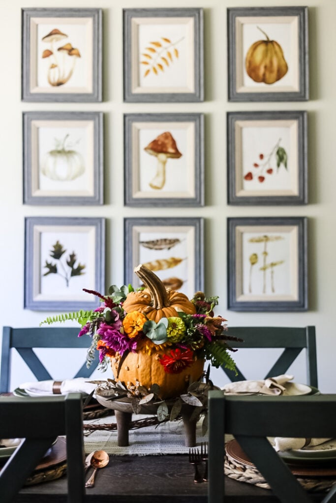 fall gallery wall behind a dining table