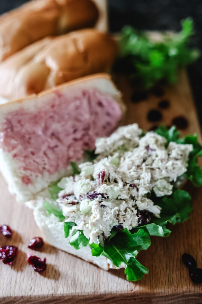 chicken salad sandwich on a cutting board