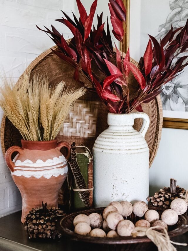 jugs filled with dried grasses