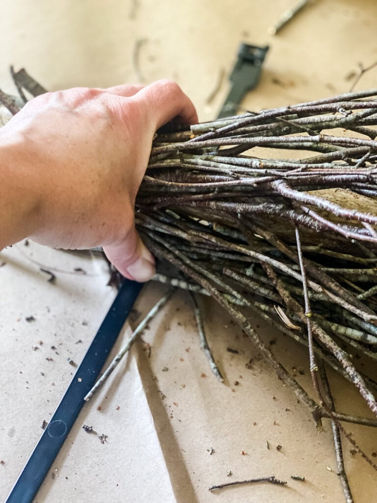 gathering birch branches to make a diy witch broom.