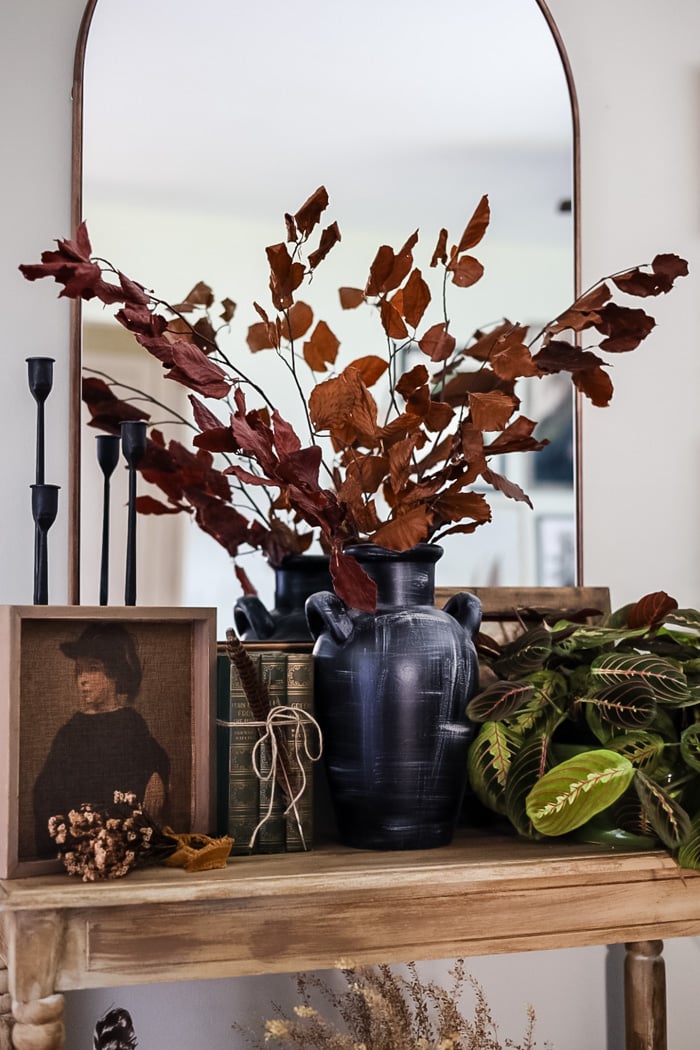preserved Fall leaves in black vase.