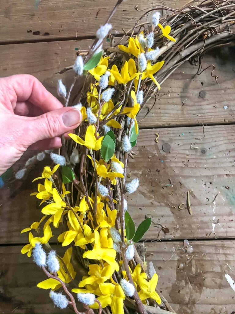 making a spring wreath with forsythia and pussy willow stems