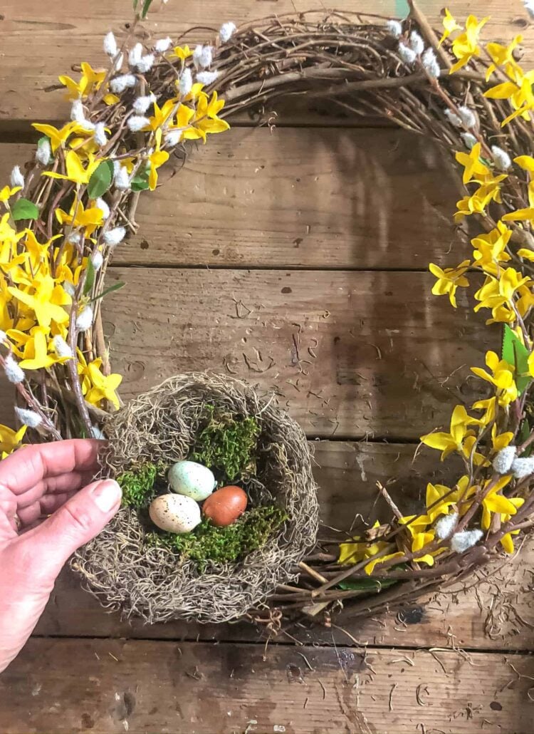 making a wreath with forsythia and a bird nest