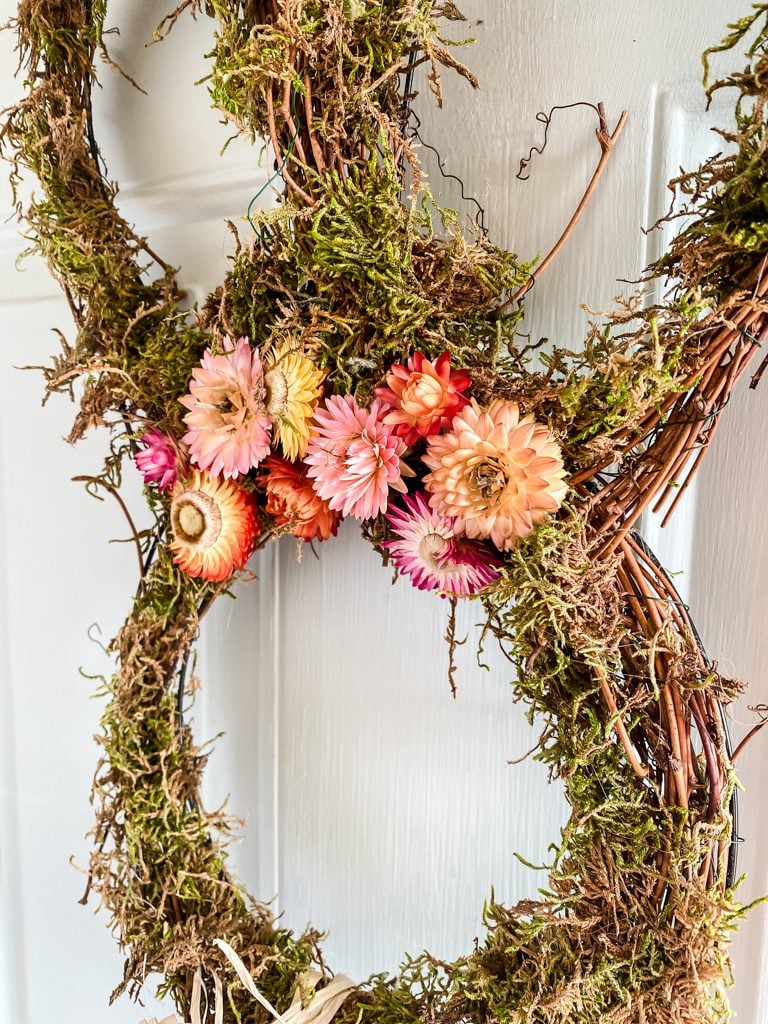 moss wreath with dried strawflowers