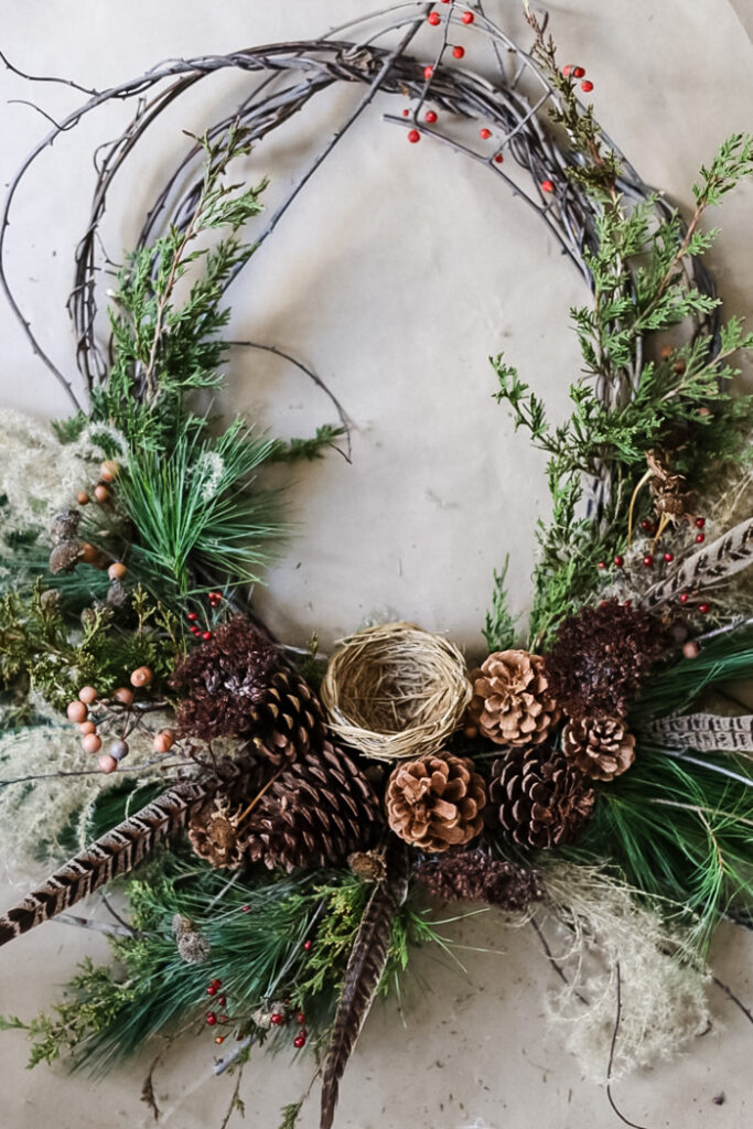 an overhead photo of a rustic winter wreath