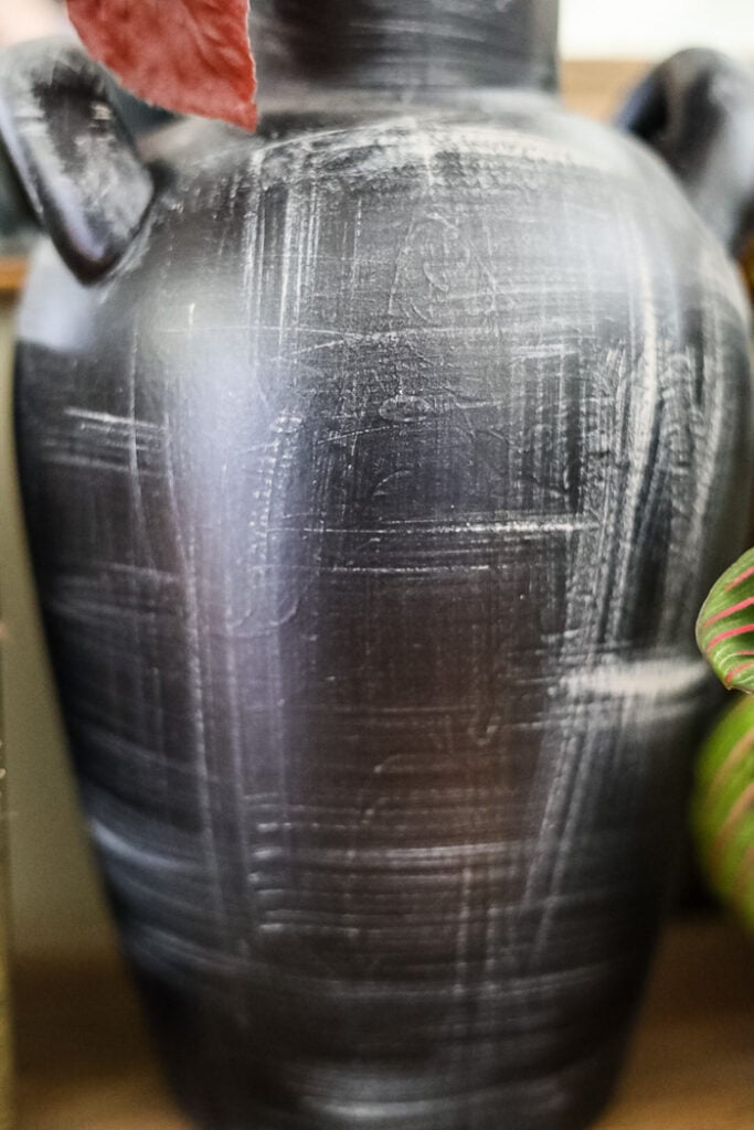 closeup of detail on upcycled thrift store vase painted black