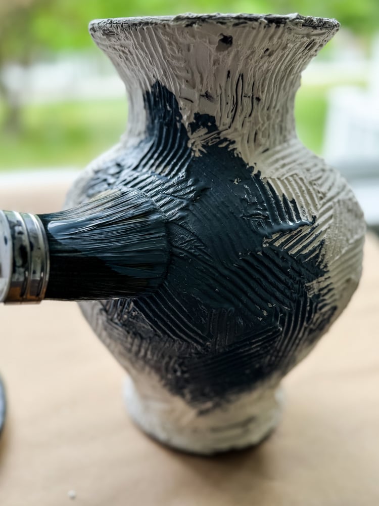 painting a vase blue