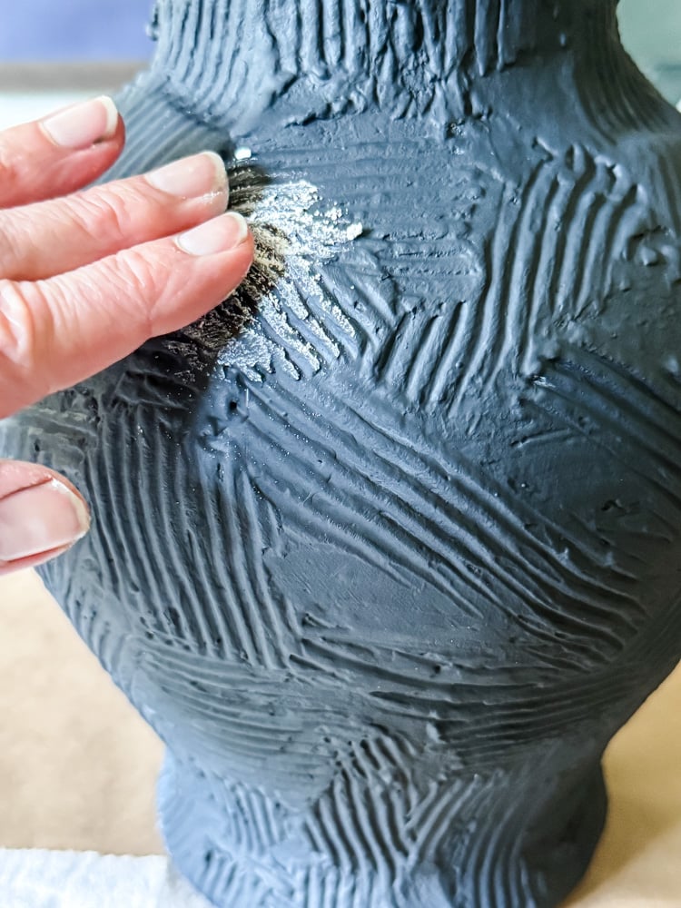 rubbing chalk dust on vase to create aged look